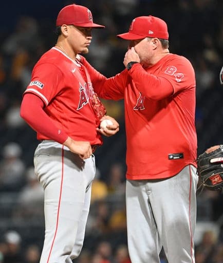 Los Angeles Angels rerlief pitcher Samy Natera Jr. gets a mound visit from pitching coach Tim LeLeveque during the eight inning as they take on the Pittsburgh Pirates in a baseball game, Friday, Sept. 4, 2026, in Pittsburgh. (AP Photo/Philip G. Pavely) (AP Photo/Philip G. Pavely)