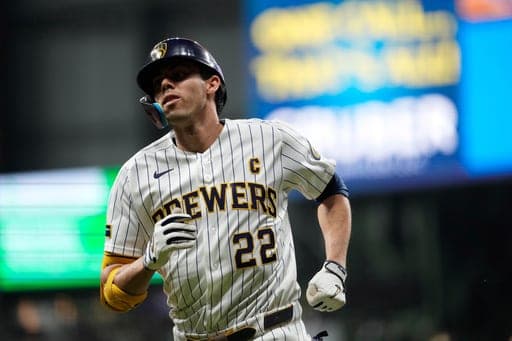 Milwaukee Brewers' Christian Yelich jogs to the dugout after flying out during the sixth inning of a baseball game against the St. Louis Cardinals, Saturday, Sept. 26, 2026, in Milwaukee. (AP Photo/Aaron Gash) (AP Photo/Aaron Gash)
