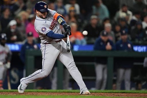 Houston Astros' Yainer Diaz hits an RBI triple during the 10th inning of a baseball game against the Seattle Mariners, Wednesday, Sept. 23, 2026, in Seattle. (AP Photo/Lindsey Wasson) (AP Photo/Lindsey Wasson)