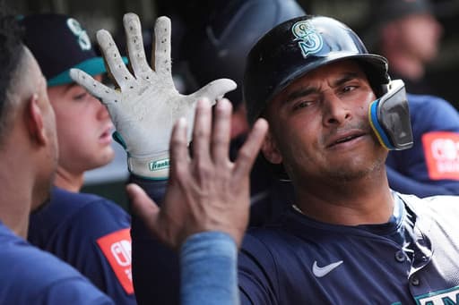 Donovan Solano hits 2 homers as the Seattle Mariners beat the Chicago Cubs 14-6