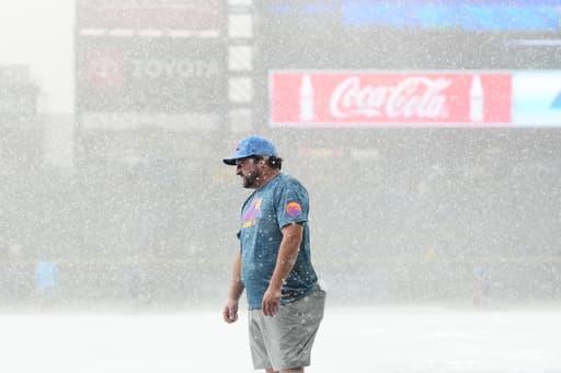 Sugano helps the Rockies beat the Royals 3-1 in game delayed at start by hailstorm