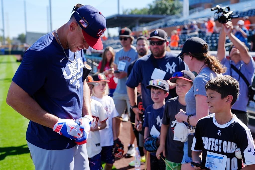Aaron Judge signs autographs for fans before Team USA’s game against the San Francisco Giants in Scottsdale.