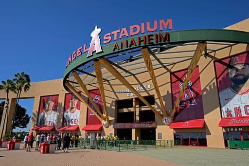 FILE - People line up outside Angel Stadium prior to a baseball game between the Los Angeles Angels and the Cleveland Guardians, Aug. 24, 2026, in Anaheim, Calif. (AP Photo/Jayne Kamin-Oncea, File) (AP Photo/Jayne Kamin-Oncea)