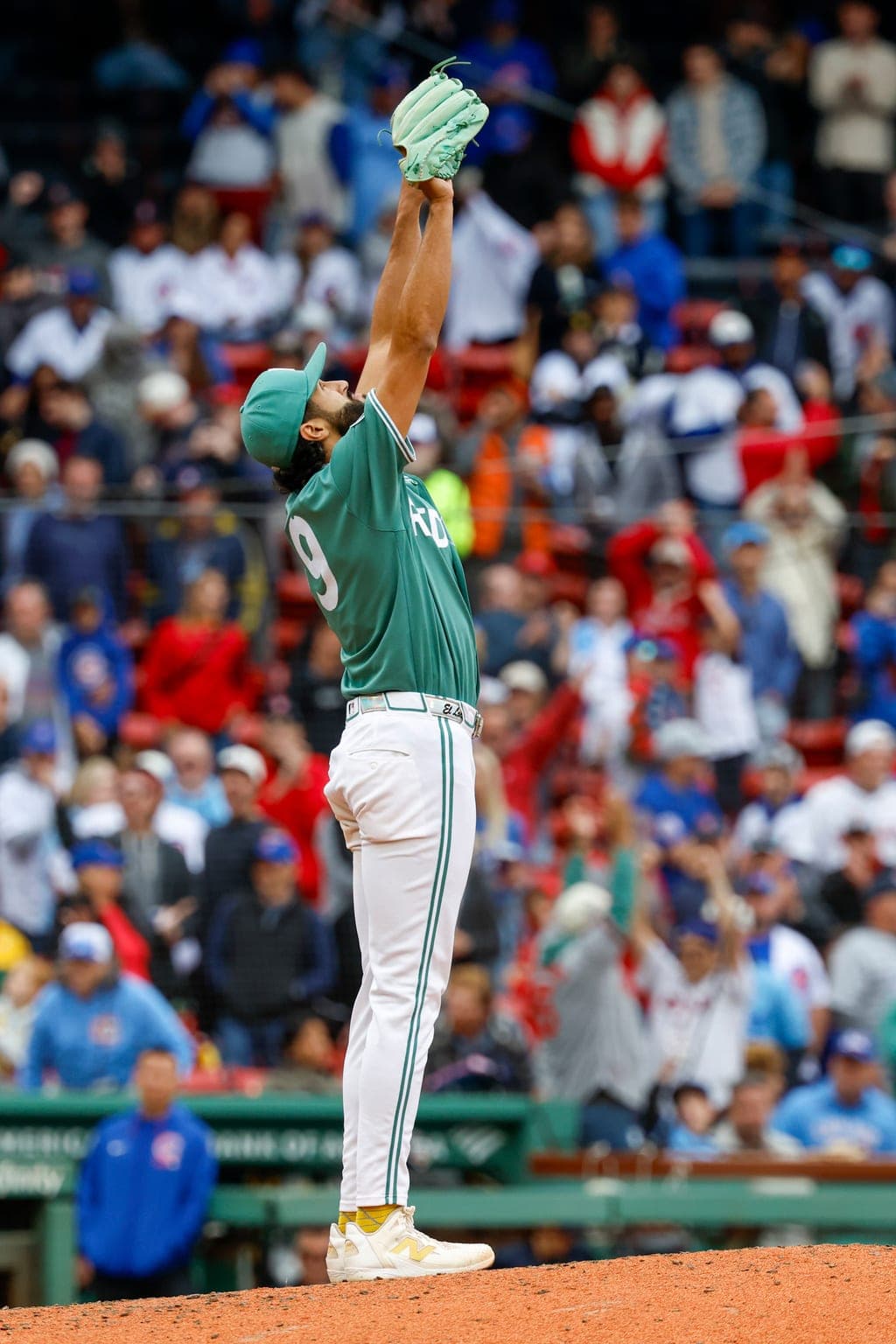 Boston Red Sox pitcher Raymon Burgos reacts after defeating the Chicago Cubs