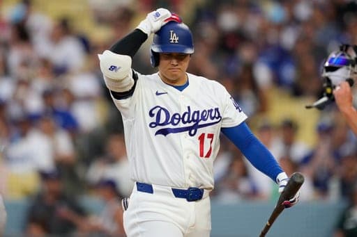 Los Angeles Dodgers' Shohei Ohtani walks back to the dugout after striking out as during the third inning of a baseball game against the Cincinnati Reds, Monday, Sept. 7, 2026, in Los Angeles. (AP Photo/Mark J. Terrill) (AP Photo/Mark J. Terrill)