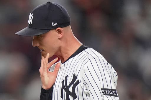 Boone defends his moves after Yankees bullpen falters again in playoff-opening loss to the Red Sox