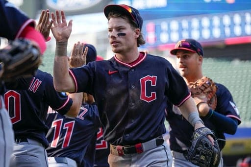 Cleveland Guardians' Travis Bazzana high fives teammates after the Guardians' win in a baseball game against the Minnesota Twins, Sunday, Sept. 13, 2026, in Minneapolis. (AP Photo/Joseph Scheller) (AP Photo/Joseph Scheller)