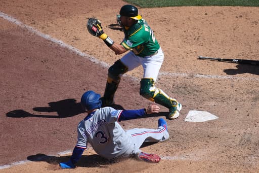 Rangers rally for 4 runs in the 9th inning to beat the Athletics 9-6