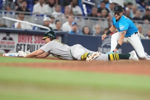 Kurtz triples, scores and Ferguson retires 3 straight in the 9th to lift A’s over Marlins 3-2