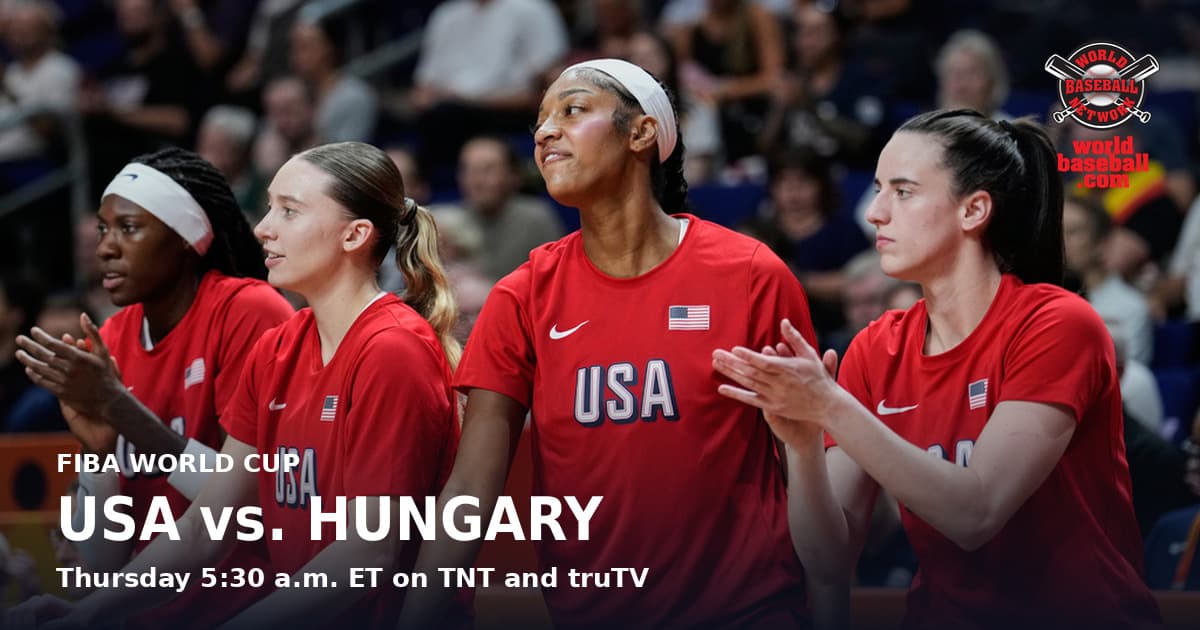 Caitlin Clark and Angel Reese applaud from the sideline in red United States warmups during a Women's Basketball World Cup match in Berlin.