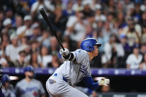 Los Angeles Dodgers' Shohei Ohtani doubles off Colorado Rockies relief pitcher TJ Shook in the eighth inning of a baseball game Monday, Aug. 17, 2026, in Denver. (AP Photo/David Zalubowski) (AP Photo/David Zalubowski)