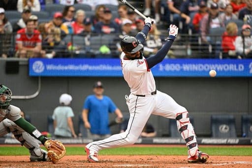 Cleveland Guardians' Jo Adell watches his infield RBI single off Athletics starting pitcher Jack Perkins during the fourth inning of a baseball game, Sunday, Sept. 20, 2026, in Cleveland. (AP Photo/Phil Long) (AP Photo/Phil Long)