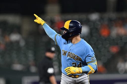 Milwaukee Brewers catcher William Contreras (24) points after hitting a solo home run against the Baltimore Orioles in the fourth inning of a baseball game, Sunday, Sept. 20, 2026, in Baltimore. (AP Photo/Gail Burton) (AP Photo/Gail Burton)