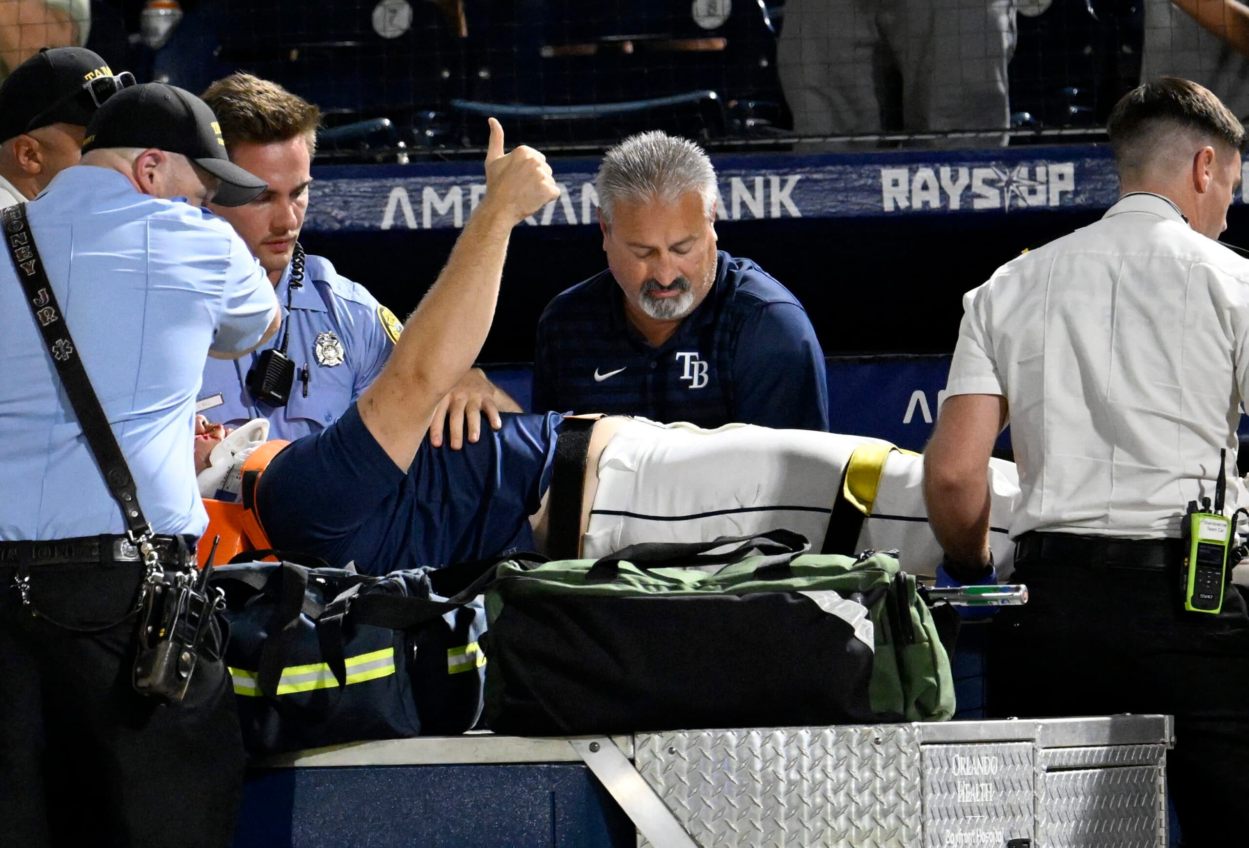 Rays pitcher carted off field after foul ball strikes him in dugout
