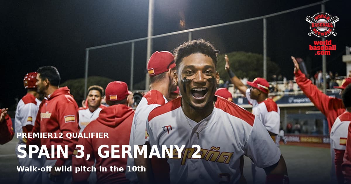 A Spain player celebrates with teammates after beating Germany in ten innings at the Premier12 Barcelona Qualifier.