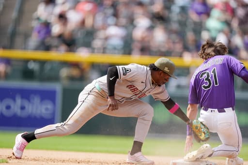 McCarthy singles twice and has an RBI against former team, helping Rockies beat Diamondbacks 4-2
