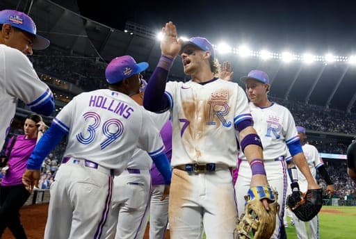 Kansas City Royals shortstop Bobby Witt Jr. (7) celebrates with his team after a baseball game against the Detroit Tigers in Kansas City, Mo., Friday, Aug. 21, 2026. (AP Photo/Colin E. Braley) (AP Photo/Colin E. Braley)