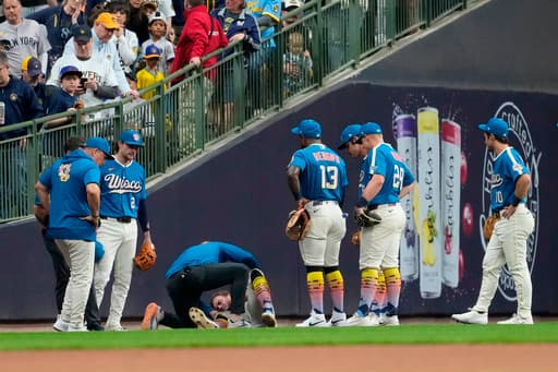 Brewers outfielder Brandon Lockridge carted off field after crashing into wall chasing foul ball