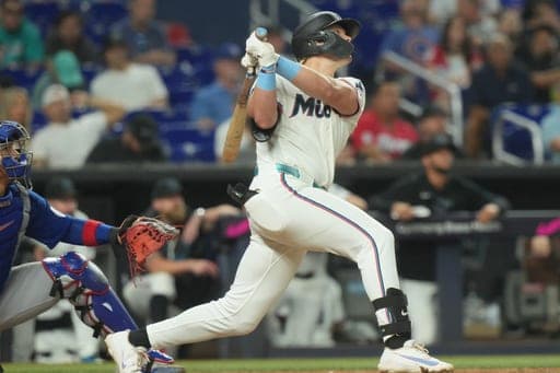 Miami Marlins' Kyle Stowers hits a home run during the seventh inning of a baseball game against the Chicago Cubs Saturday, Sept. 5, 2026, in Miami. (AP Photo/Marta Lavandier) (AP Photo/Marta Lavandier)