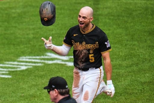 Pittsburgh Pirates' Brandon Lowe tosses his helmet as he approaches home plate after hitting a walk-off solo home run off Detroit Tigers pitcher Kenley Jansen in the ninth inning of a baseball game in Pittsburgh, Wednesday, Aug. 19, 2026. (AP Photo/Gene J. Puskar) (AP Photo/Gene J. Puskar)