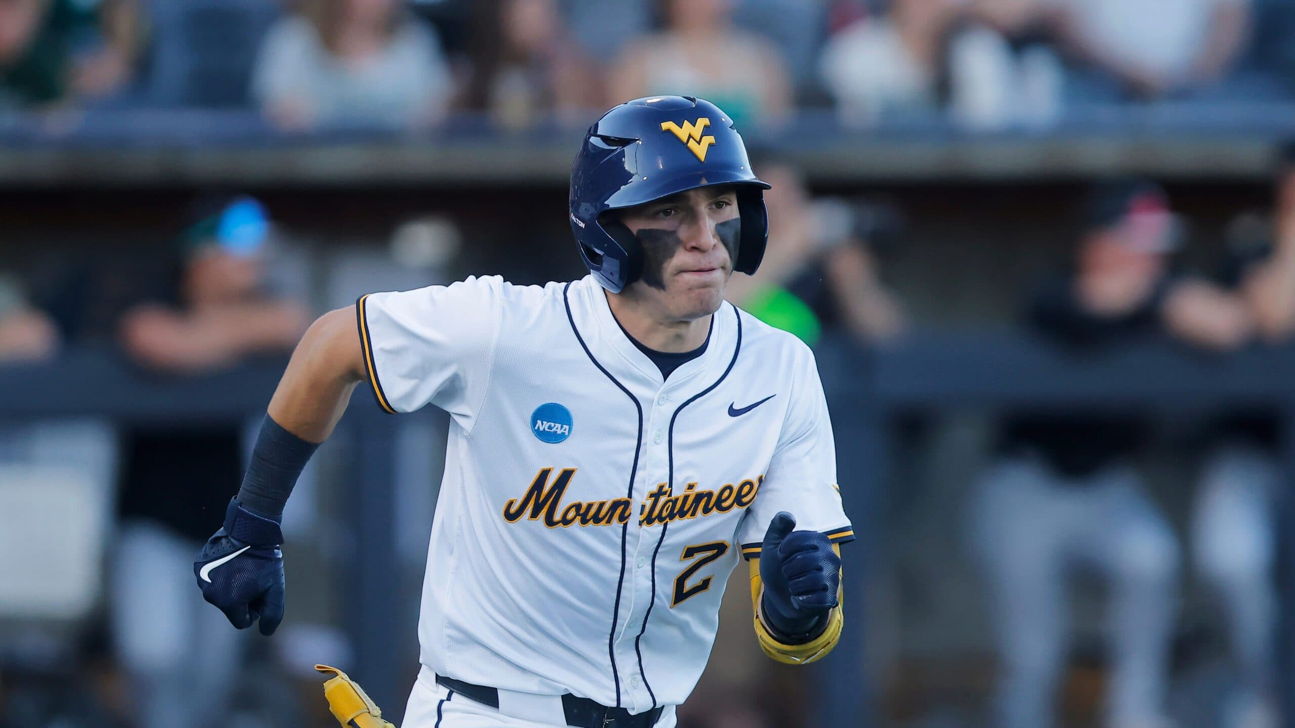West Virginia catcher Gavin Kelly (2) runs to first base during an NCAA regional baseball game against Binghamton on Friday, May 29, 2026, in Morgantown,W.Va. West Virginia won 10-1. (AP Photo/Mike Buscher)