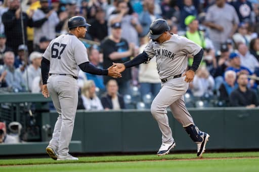 Grisham hits 2 homers to lead Yankees past Mariners 11-5, New York’s Cabrera leaves in ambulance