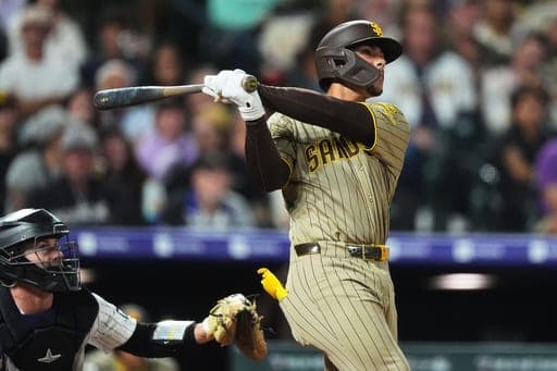 San Diego Padres catcher Ethan Salas watches his two-run home run off Colorado Rockies relief pitcher Nick Frasso in the fifth inning of a baseball game Wednesday, Sept. 16, 2026, in Denver. (AP Photo/David Zalubowski) (AP Photo/David Zalubowski)