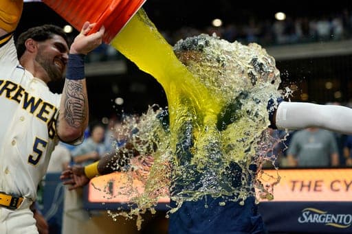 Milwaukee Brewers' Luis Lara is dunked by Garrett Mitchell after a baseball game against the Chicago Cubs, Tuesday, Sept. 8, 2026, in Milwaukee. (AP Photo/Aaron Gash) (AP Photo/Aaron Gash)