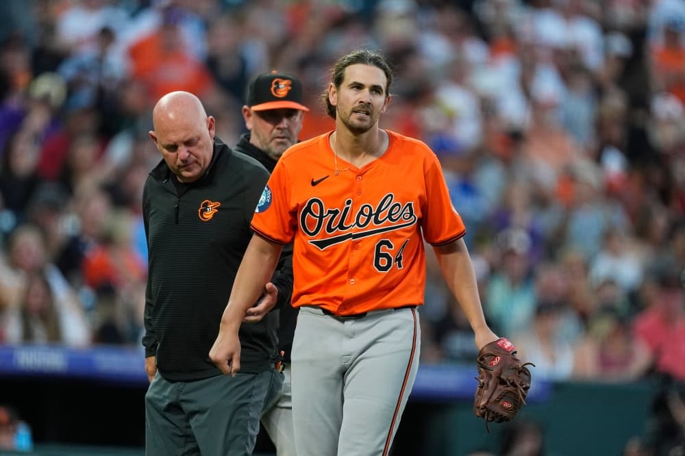 Orioles pitcher Dean Kremer departs after he gets hit on his right forearm by a line drive