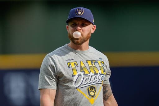 Milwaukee Brewers first baseman Jake Bauers blows a bubble during practice ahead of Game 1 of baseball's National League Championship Series between the Milwaukee Brewers and the Los Angeles Dodgers, Saturday, Oct. 10, 2026, in Milwaukee. (AP Photo/Kyla Wolf) (AP Photo/Kyla Wolf)