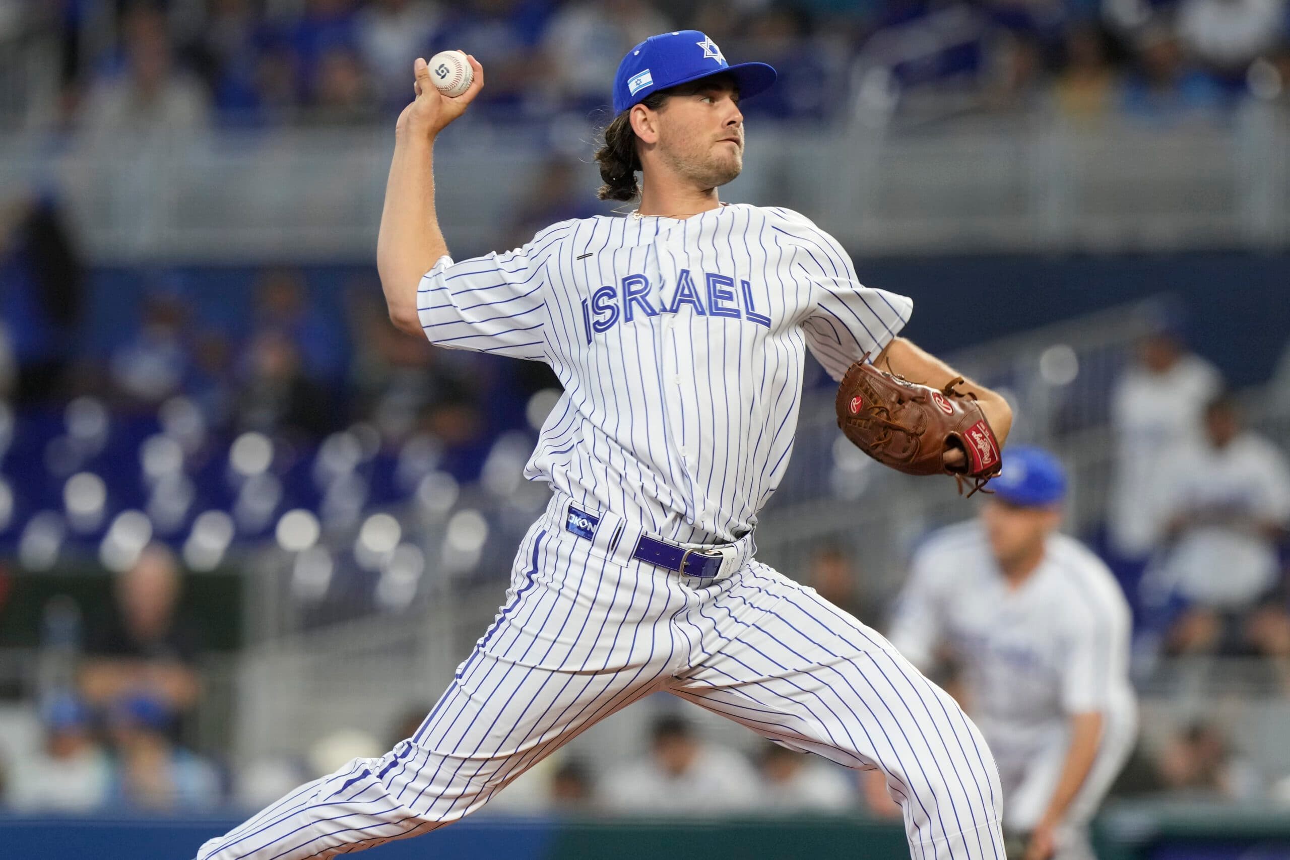 Dean Kremer (17) aims a pitch during the first inning of a World Baseball Classic game against Nicaragua, Sunday, March 12, 2023, in Miami. (AP Photo/Marta Lavandier)