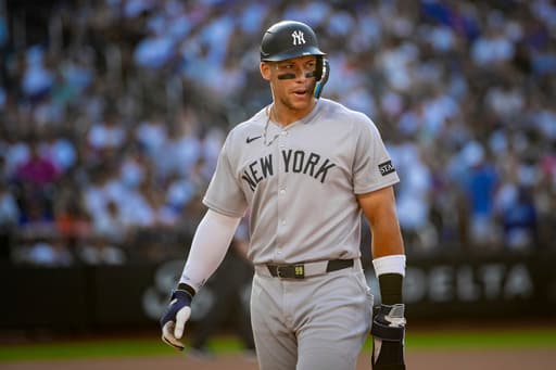 Aaron Judge gets struck in the face by a toss from Yankees teammate Anthony Volpe