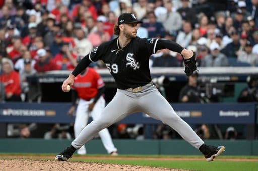Chicago White Sox relief pitcher Sean Burke (59) delivers during the third inning of Game 2 of baseball's American League Division Series against the Cleveland Guardians, Monday, Oct. 5, 2026, in Cleveland. (AP Photo/Phil Long) (AP Photo/Phil Long)