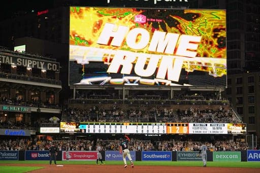 San Diego Padres' Jackson Merrill, center, celebrates after hitting a home run during the eighth inning of a baseball game against the Miami Marlins Friday, Sept. 18, 2026, in San Diego. (AP Photo/Gregory Bull) (AP Photo/Gregory Bull)