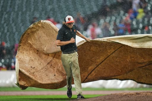 Phillies rout Orioles 8-0 in a game called by rain after 5 1/2 innings