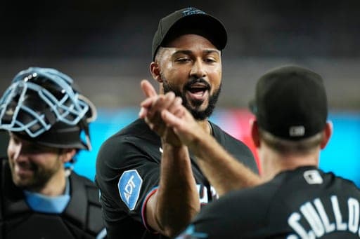 Miami Marlins pitcher Sandy Alcantara, left, celebrates a win against the Arizona Diamondbacks with Marlins manager Clayton McCullough after a baseball game, Wednesday, Sept. 16, 2026, in Phoenix. (AP Photo/Ross D. Franklin) (AP Photo/Ross D. Franklin)
