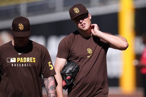 San Diego Padres pitcher Mason Miller, right, walks with pitcher Adrian Morejon during training a day before Game 3 of a National League Division Series baseball game against the Milwaukee Brewers Monday, Oct. 5, 2026, in San Diego. (AP Photo/Gregory Bull) (AP Photo/Gregory Bull)