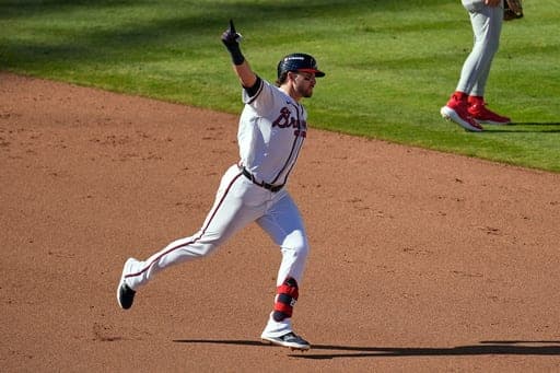 Atlanta Braves' Austin Riley celebrates hitting a three-run home run against the Philadelphia Phillies in the eighth inning during Game 1 of baseball's National League Wild Card Series Tuesday, Sept. 29, 2026, in Atlanta. (AP Photo/Mike Stewart) (AP Photo/Mike Stewart)