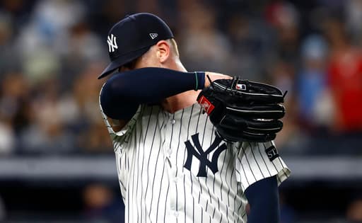 Yanks’ Ian Hamilton, frustrated with himself, stares down A’s rookie Jacob Wilson
