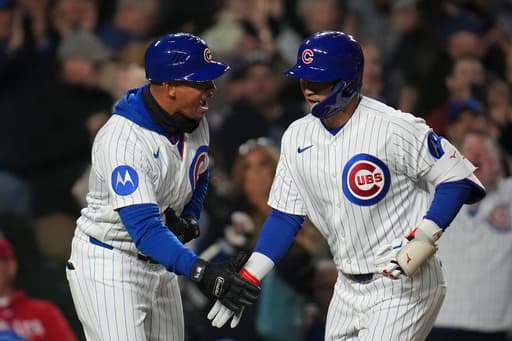 Busch and Suzuki homer as the Cubs beat the sliding Phillies 7-2 for their 8th straight win
