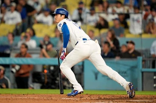 Los Angeles Dodgers' Shohei Ohtani heads to first for a double during the ninth inning of a baseball game against the San Diego Padres, Thursday, Sept. 24, 2026, in Los Angeles. (AP Photo/Mark J. Terrill) (AP Photo/Mark J. Terrill)