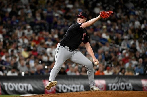 Cleveland Guardians pitcher Tim Herrin winds up to deliver in the sixth inning of a baseball game against the Colorado Rockies, Friday, Aug. 21, 2026, in Denver. (AP Photo/Geneva Heffernan) (AP Photo/Geneva Heffernan)