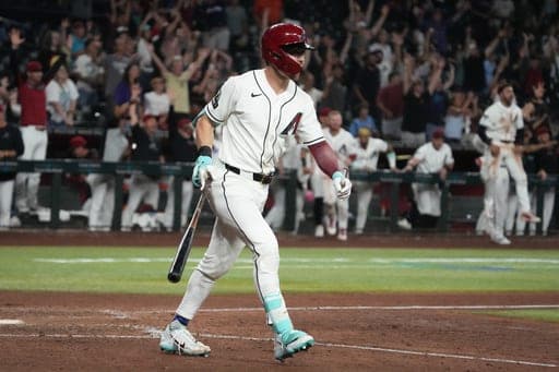 Arizona Diamondbacks' Corbin Carroll hits a two-run walk-off home run against the Miami Marlins in the ninth inning of a baseball game, Monday, Sept. 14, 2026, in Phoenix. (AP Photo/Rick Scuteri) (AP Photo/Rick Scuteri)
