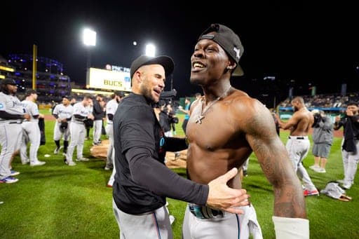 FILE - Miami Marlins' Jazz Chisholm Jr., right, celebrates with manager Skip Schumaker after clinching a playoff berth with a win over the Pittsburgh Pirates in a baseball game in Pittsburgh, Sept. 30, 2023. (AP Photo/Gene J. Puskar, File) (AP Photo/Gene J. Puskar)