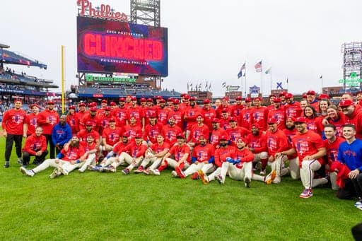 The Philadelphia Phillies pose after they defeated the Tampa Bay Rays, clinching a Wild Card slot in post season baseball play, Sunday, Sept. 27, 2026, in Philadelphia. (AP Photo/Laurence Kesterson) (AP Photo/Laurence Kesterson)