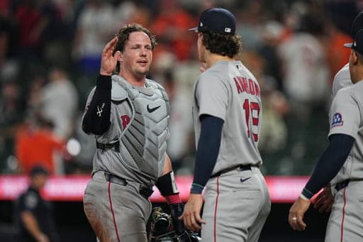Boston Red Sox catcher Adley Rutschman, left, and left fielder Roman Anthony, center, celebrate their team's victory over the Baltimore Orioles in a baseball game, Thursday, Sept. 3, 2026, in Baltimore. (AP Photo/Stephanie Scarbrough) (AP Photo/Stephanie Scarbrough)