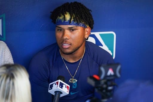 Seattle Mariners shortstop Michael Arroyo attends a news conference in the dugout before his major league debut against the Athletics, Sunday, Sept. 6, 2026, in Seattle. (AP Photo/Eric Hiller) (AP Photo/Eric Hiller)