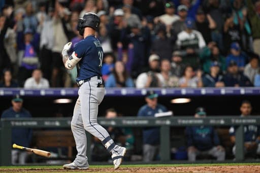 Seattle Mariners' Weston Wilson tosses his bat after striking out to end a baseball game against the Colorado Rockies, Saturday, Sept. 19, 2026, in Denver. (AP Photo/RJ Sangosti) (AP Photo/RJ Sangosti)