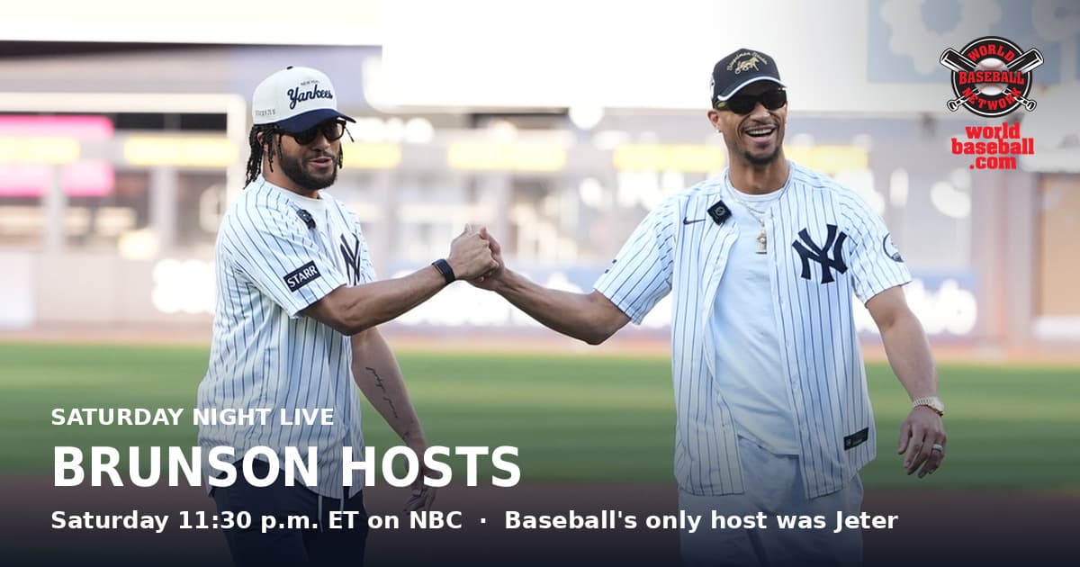 Jalen Brunson and Josh Hart bump fists in Yankees jerseys at Yankee Stadium after throwing out a ceremonial first pitch.