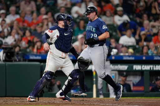 Cal Raleigh tried a full-uniform shower. The next night, his bat finally woke up